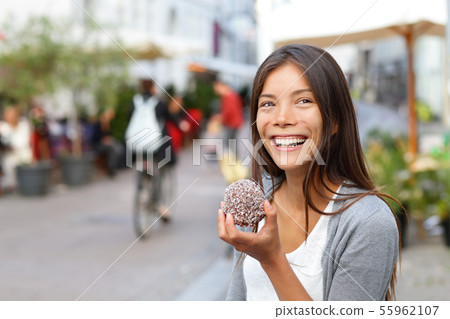 Woman eating traditional danish food floedeboller Woman eating traditional danish food floedeboller 55962107