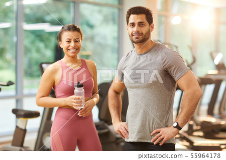 Sportive Couple Posing in Gym 55964178