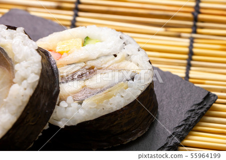 Up of mackerel sushi on a slate plate. 55964199