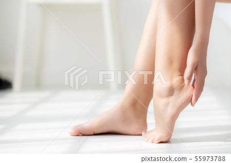 Closeup beautiful young asian woman applying cream Closeup beautiful young asian woman applying cream 55973788