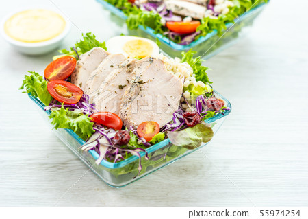 Grilled chicken breast and meat salad 55974254