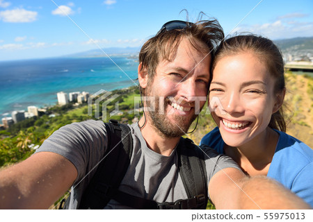 Selfie couple travel fun with Honolulu Hawaii 55975013