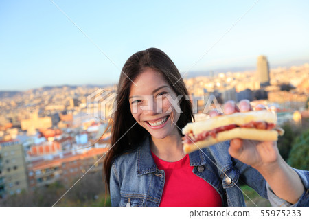 Jamon Serrano Sandwich - woman eating in Barcelona 55975233