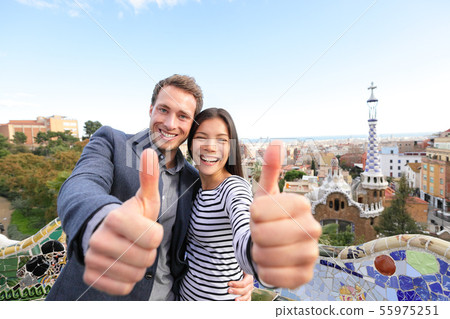 Travel couple happy in Park Guell, Barcelona 55975251