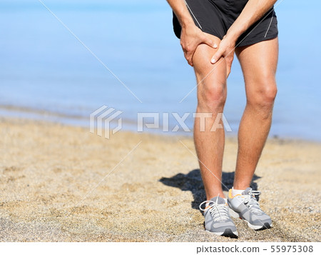 Muscle injury. Runner man with sprain thigh muscle 55975308