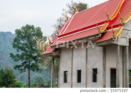 Thai temple beside the mountain 55975397
