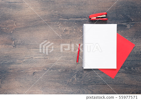 Red and white stationery on wooden desk Red and white stationery on wooden desk 55977571