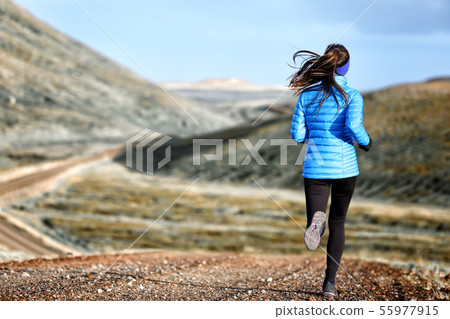 Woman winter and autumn running in down jacket 55977915