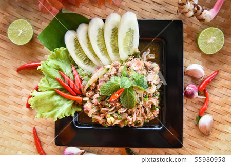 Spicy minced pork salad Thai food served on tray Spicy minced pork salad Thai food served on tray 55980958