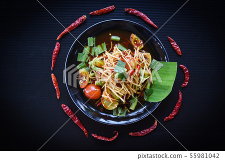 Papaya salad served on black background / Green 55981042