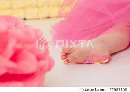 leg of baby food on white background. Feet and cake 55981108