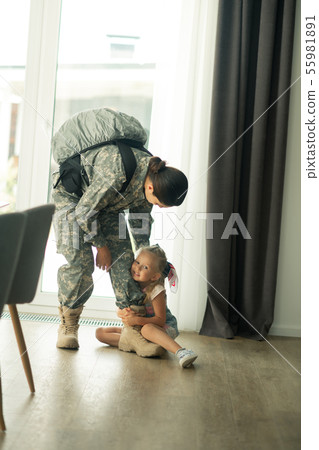 Daughter not letting go mother serving in armed forces Daughter not letting go mother serving in armed forces 55981891