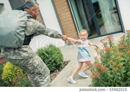 Blonde girl feeling unhappy while father leaving for half a year Blonde girl feeling unhappy while father leaving for half a year 55982018