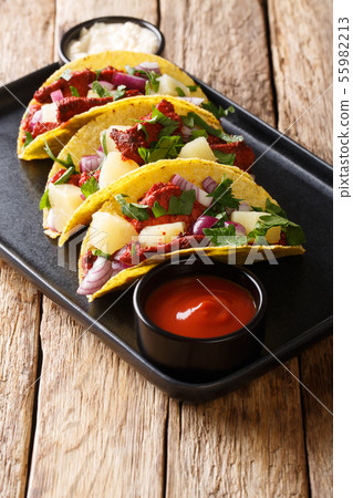 Traditional Mexican tacos al pastor with pork, Traditional Mexican tacos al pastor with pork, 55982213