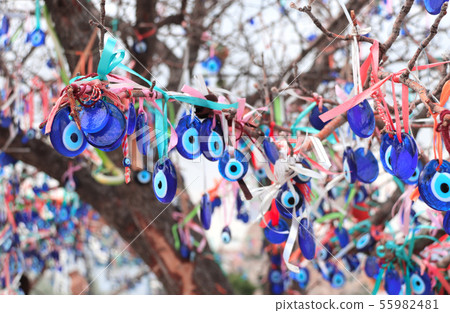 Evil eye charms hang from a tree in Cappadocia, 55982481