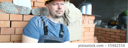 Concerned man in hardhat 55982558