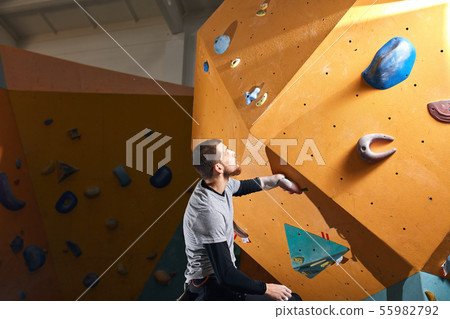 Climber gets ready to bouldering competition among people with physical disabilities Climber gets ready to bouldering competition among people with physical disabilities 55982792