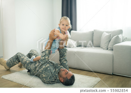 Little cute daughter feeling amazing playing with daddy 55982854