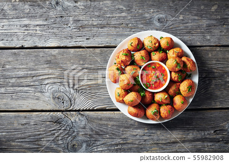 banana fritters Klako on a white plate 55982908