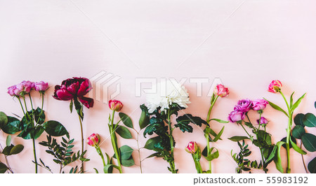 Summer flowers flat-lay over pastel pink 55983192