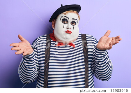 I don't know. puzzled man with raised arm expresses his disinterest 55983946