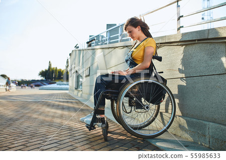 beautiful woman with physical challenges working from home beautiful woman with physical challenges working from home 55985633