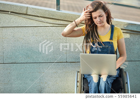 attractive young woman in fashion clothes attends vebinars.activity limitation. attractive young woman in fashion clothes attends vebinars.activity limitation. 55985641