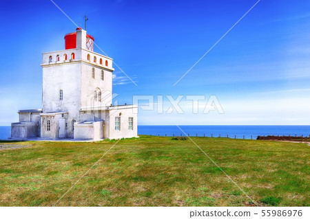 Landscape with white lighthouse at Cape Dyrholaey Landscape with white lighthouse at Cape Dyrholaey 55986976