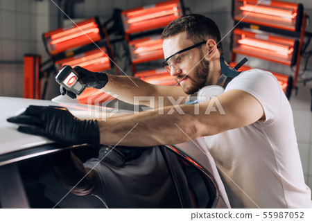qualified master testing the polishing of the car 55987052