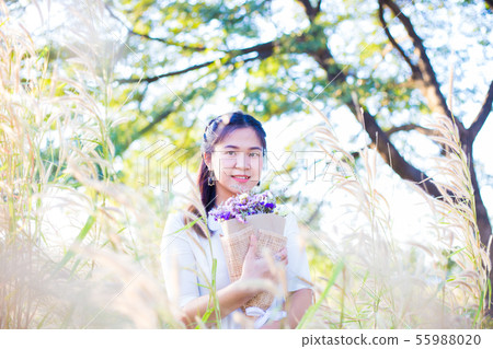 Beautiful fashion women in tree forest sunset Beautiful fashion women in tree forest sunset 55988020