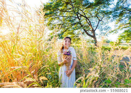 Fashion women in white dress with dry flower Fashion women in white dress with dry flower 55988021