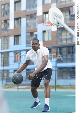 African Basketball Player Dribbling Ball 55988838
