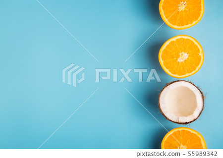 Bright tropical fruits on a blue background Bright tropical fruits on a blue background 55989342