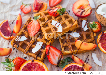 Waffles with strawberries, coconut, plum 55989415