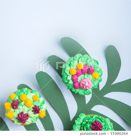 Multicolored cupcakes with decoration like indoor 55990264