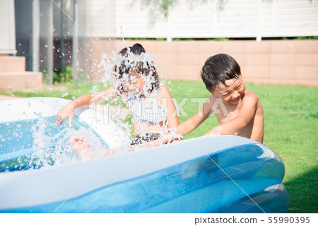 Children playing in the pool at home 55990395