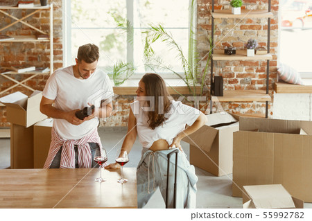 Young couple moved to a new house or apartment 55992782