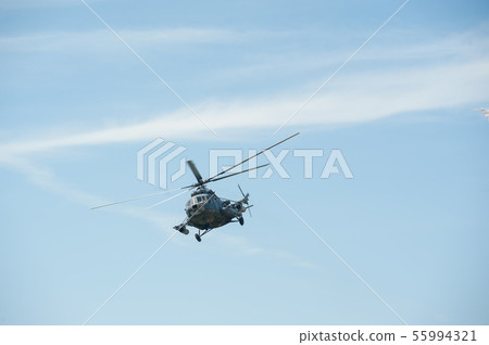 Russian military helicopter MI-8 in the cloudy sky Russian military helicopter MI-8 in the cloudy sky 55994321