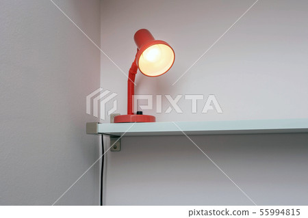 Lamp night light on shelf with white wall background, space for text 55994815