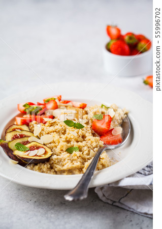 Quinoa breakfast porridge with strawberries  55996702