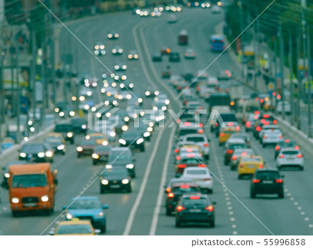 Blurred motion on city highway in rain day 55996858