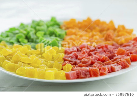 Dried pineapple in a white plate Dried pineapple in a white plate 55997610