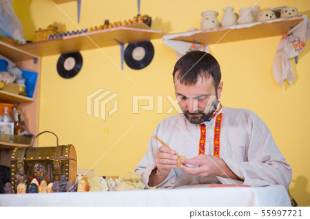 Potter making clay figure for board game 55997721