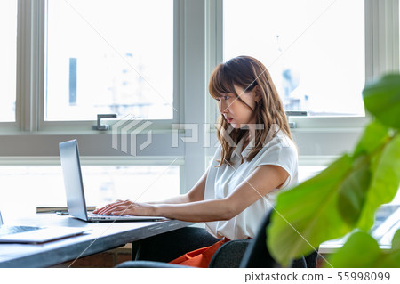 Young woman working in office 55998099