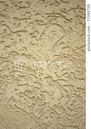 The texture of the beige decorative plaster in The texture of the beige decorative plaster in 55998700
