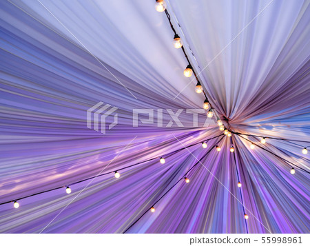 Vintage light bulbs under fabric tent ceiling 55998961