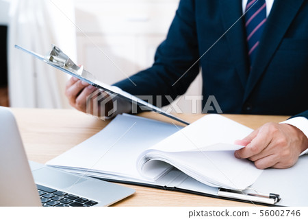 Documents and businessmen 56002746