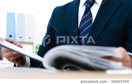 Documents and businessmen Documents and businessmen 56003704