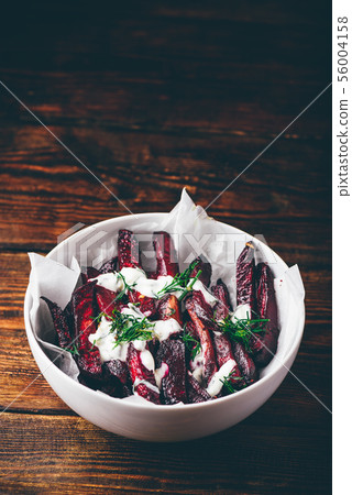 Oven baked beet fries with sour cream and dill Oven baked beet fries with sour cream and dill 56004158