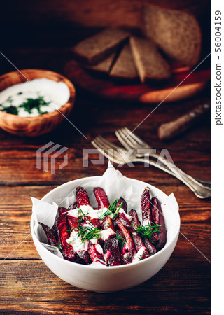 Oven baked beet fries with greek yogurt and dill Oven baked beet fries with greek yogurt and dill 56004159